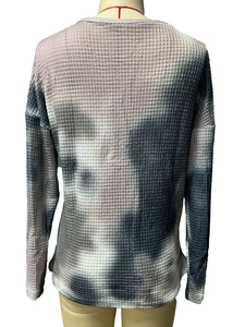Detail view of the back of tie-dye waffle knit long sleeve top with pink and grey pattern