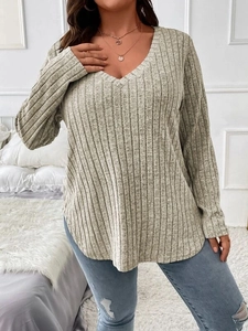 Detail of grey V-neck ribbed knit long sleeve plus size top for women on model