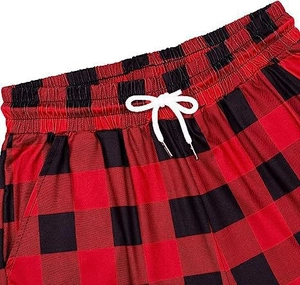 Detail of buffalo plaid lounge pants featuring an elastic drawstring waist and soft texture