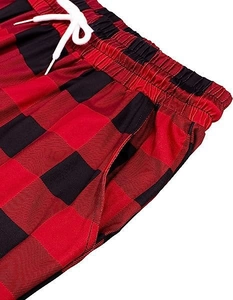 Detail of red buffalo plaid pajama pants with elastic drawstring waist and side pockets