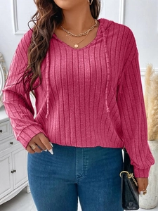 Detail of ribbed texture and V-neck drawstring on women's magenta oversized hoodie