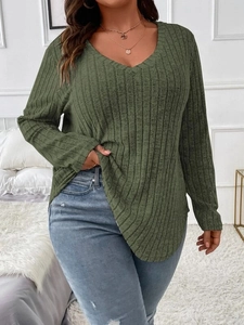 Detailed view of the army green ribbed knit fabric and V-neckline on the long sleeve top