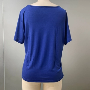 Back view of a deep blue short-sleeved crewneck t-shirt made from knit cotton fabric