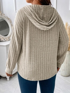 Detailed back view of a beige V-neck hooded ribbed long sleeve t-shirt for women