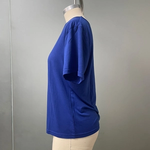 Side view of dark blue short sleeve t-shirt showing the crew neck and soft cotton fabric