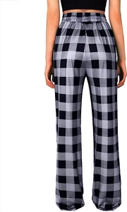 Rear view of women's high-waisted wide-leg trousers in classic black and white plaid