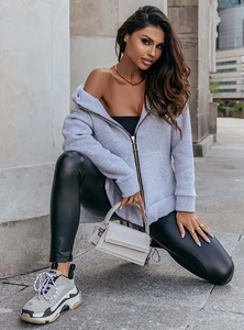 Detail of grey oversized zip hoodie with large round ring pull and drop shoulder design
