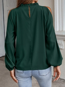 Detail of dark green cold shoulder top featuring ruffled high neck and back button closure
