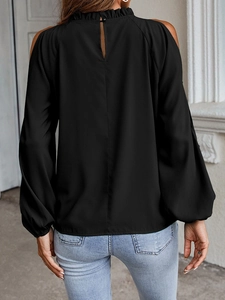 Detail view showing the elegant back keyhole cutout and ruffle collar of the black top