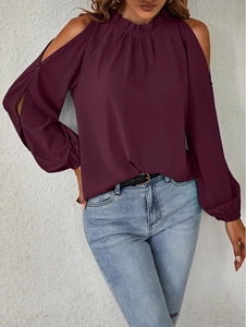 Detail of burgundy off-shoulder top featuring ruffled round neck and lantern sleeves