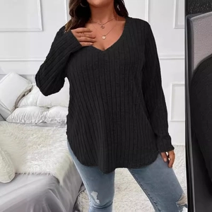Women's V-neck long sleeve black ribbed knit top with curved hem in a loose fit