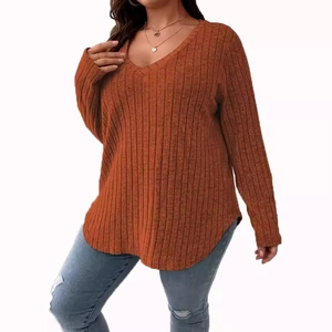 Women's plus-size orange ribbed V-neck long-sleeve top with curved hemline and loose fit