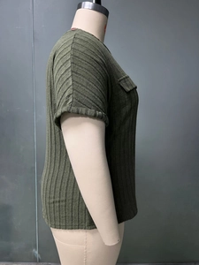 Detail view of olive green ribbed knit t-shirt featuring a chest pocket and soft texture