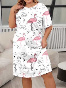 Close-up of flamingo and star print pattern on a white short-sleeve plus size dress