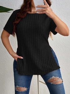 Detail view of the ribbed fabric texture and side slit design on this black women's t-shirt
