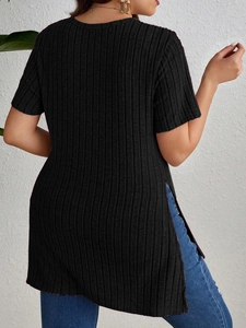 Detail view of the black ribbed knit texture and side slit design on a short sleeve top