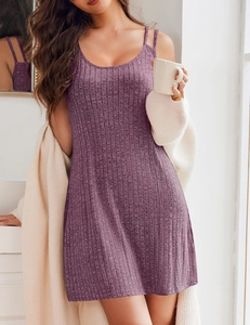 Detail of purple ribbed knit mini dress with round neck and thin straps in home setting
