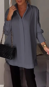 Detail view of the cold gray long sleeve shirt featuring side slits and a lapel collar