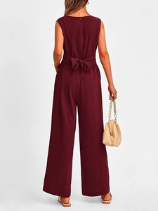 Elegant sleeveless burgundy jumpsuit featuring a stylish back bow-tie detail and wide legs