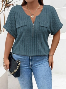 Close-up of V-neck metal zipper detail and ribbed texture on foggy blue short sleeve top