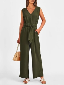 Front full-length view of elegant olive green V-neck sleeveless jumpsuit with waist belt