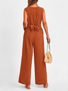 Rear view of elegant V-neck wide-leg jumpsuit with waist tie in caramel brown fabric