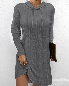 Close-up of gray cable knit texture on a long-sleeved hooded sweater dress for autumn