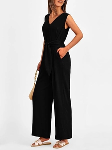 Detail of a chic black V-neck jumpsuit featuring a cinched waist and wide-leg trousers