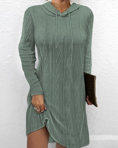 Close-up of cable knit texture on a sage green hooded knitted long-sleeved dress