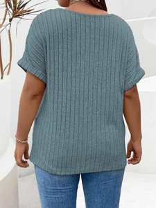 Detailed close-up of vertical ribbed knit texture on a blue-grey short sleeve plus size tee