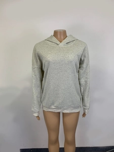 Detail of grey heather hooded sweatshirt featuring drop shoulders and ribbed cuffs
