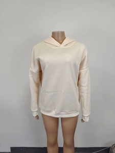 Detail view of pink oversized hoodie showing ribbed cuffs and premium cotton blend fabric