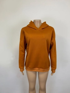 Detail view of caramel brown oversized hoodie with ribbed cuffs and hem on a mannequin