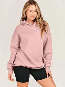 Detail view of pink oversized hoodie with drop-shoulder design and high-quality knit cotton