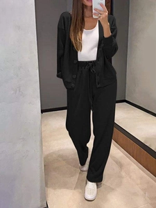 Detail of a casual black cardigan set with drawstring wide-leg pants for women