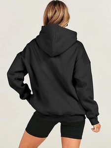 Rear view of a black oversized hoodie with drop shoulders and casual loose fit