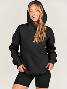 Detail of oversized black hoodie with ribbed cuffs and matching ribbed biker shorts outfit