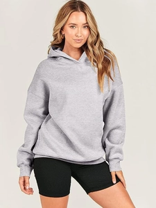 Detail of loose fit grey hoodie with ribbed cuffs and matching black ribbed shorts