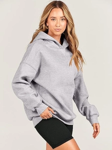Detailed texture of grey oversized hoodie fabric and stitching for women's sportswear