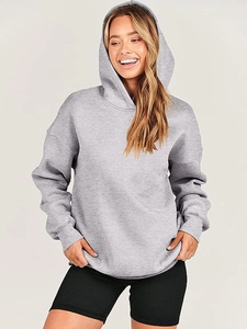 Detail view of oversized grey hoodie featuring ribbed cuffs and soft premium fabric