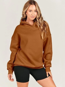 Detail of oversized hooded sweatshirt with dropped shoulders and ribbed cuffs for women