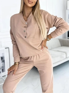 Detail view of the beige two-piece casual set featuring a half-button sweatshirt and joggers