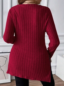 Detail view of burgundy long sleeve ribbed shirt featuring a stylish side split hem design
