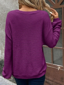 Detail view of purple waffle knit sweater back showing relaxed drop shoulder fit and texture
