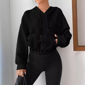 Women's black quilted waffle hoodie with drawstring hood and large front pocket