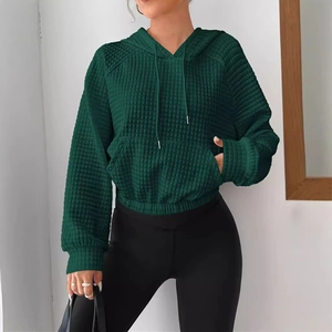 Women's dark green quilted waffle knit hoodie with drawstring and elastic hem