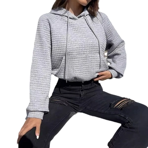 Women's grey waffle knit hooded sweatshirt with adjustable drawstrings and drop shoulder
