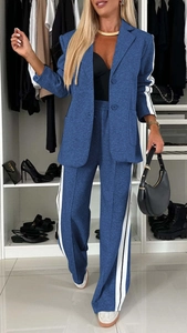 Detail of navy blue suit set with high-waisted wide-leg trousers and side stripe accents