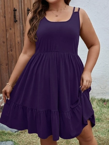 Detailed view of dark purple plus size sleeveless dress with ruffled hem and waist elastic