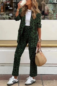 Detailed view of women's leopard print suit set featuring blazer and high waist trousers